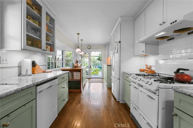 kitchen featuring white appliances, green cabinets, tasteful backsplash, dark hardwood / wood-style flooring, and decorative light fixtures