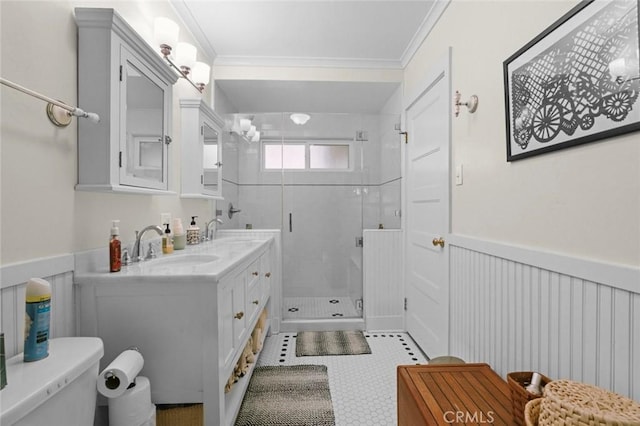 bathroom featuring crown molding, a shower with door, tile patterned flooring, vanity, and toilet