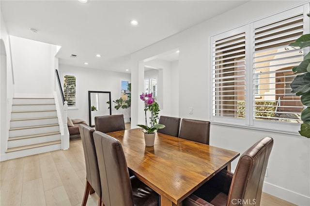 dining area featuring a wealth of natural light and light hardwood / wood-style floors