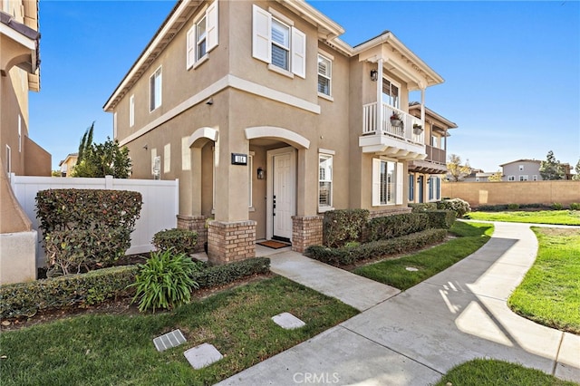 view of front of home with a balcony