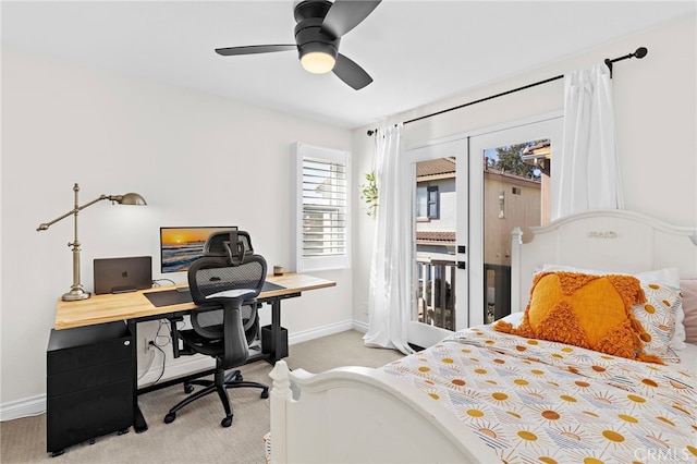 carpeted bedroom with access to exterior, ceiling fan, and french doors