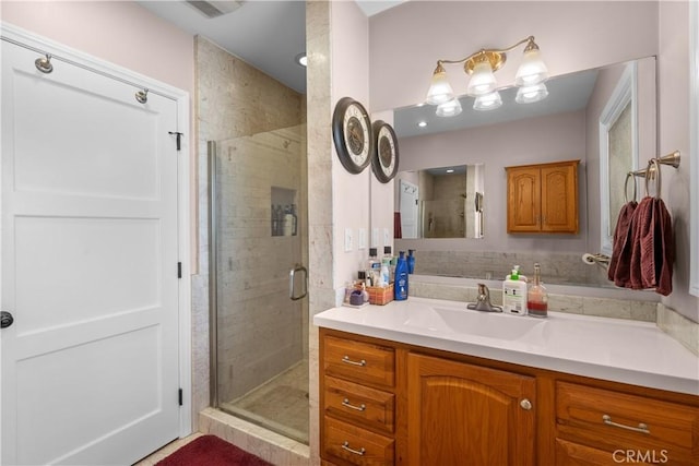 bathroom with vanity and an enclosed shower