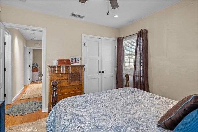 bedroom featuring a closet, ceiling fan, and light wood-type flooring