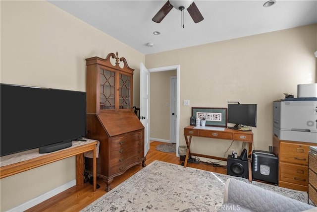 office area featuring light hardwood / wood-style floors and ceiling fan