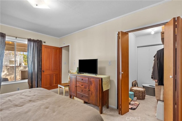 bedroom with crown molding and light colored carpet