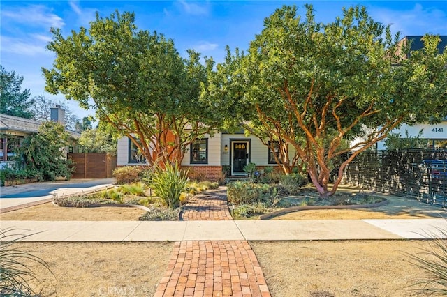 view of property hidden behind natural elements