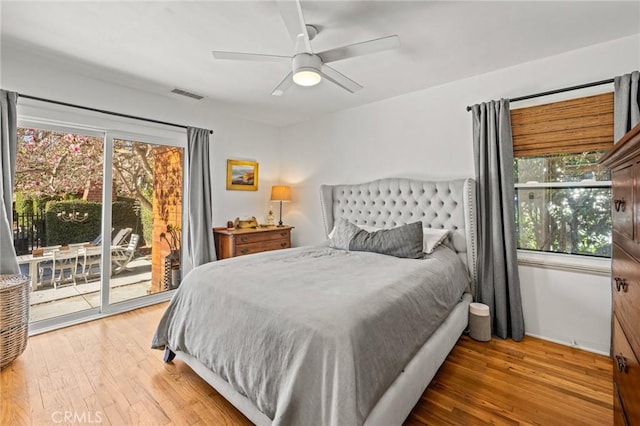 bedroom with ceiling fan, hardwood / wood-style floors, and access to outside