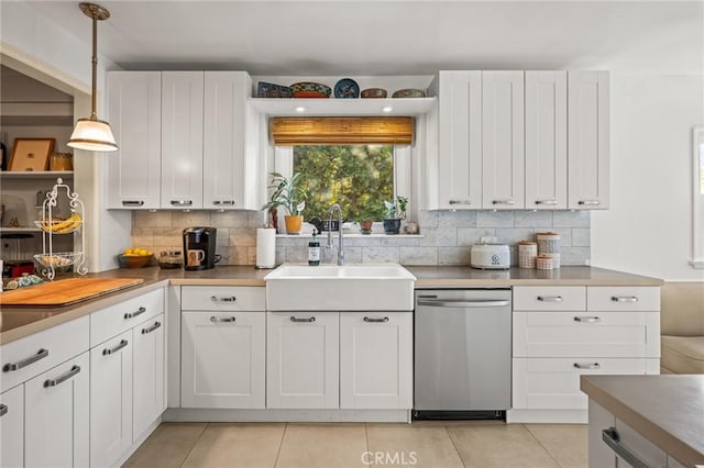 kitchen featuring white cabinetry, dishwasher, and hanging light fixtures