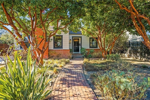 view of property hidden behind natural elements