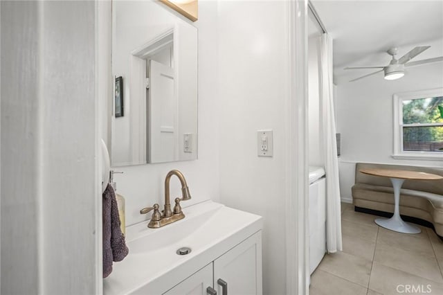 bathroom featuring ceiling fan, tile patterned floors, and vanity