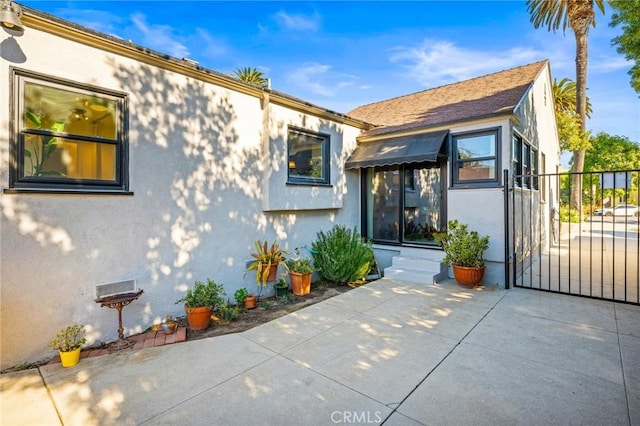 property entrance featuring a patio