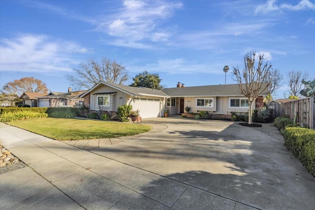 ranch-style home featuring a garage and a front lawn