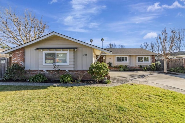 ranch-style house with a front lawn