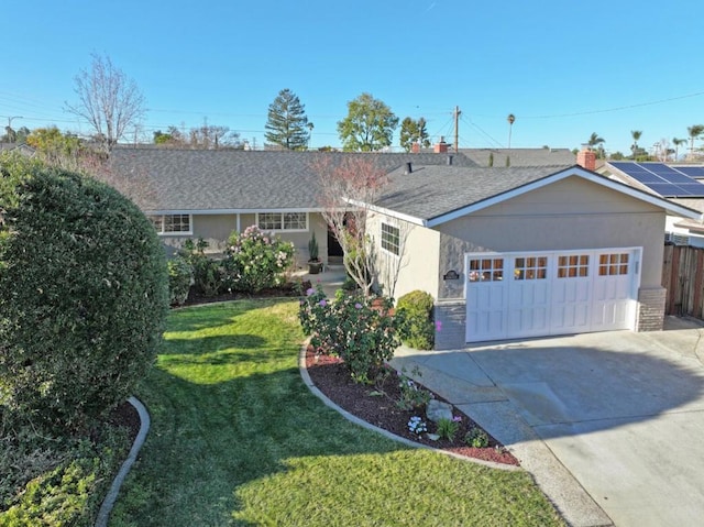 ranch-style home featuring a garage and a front yard