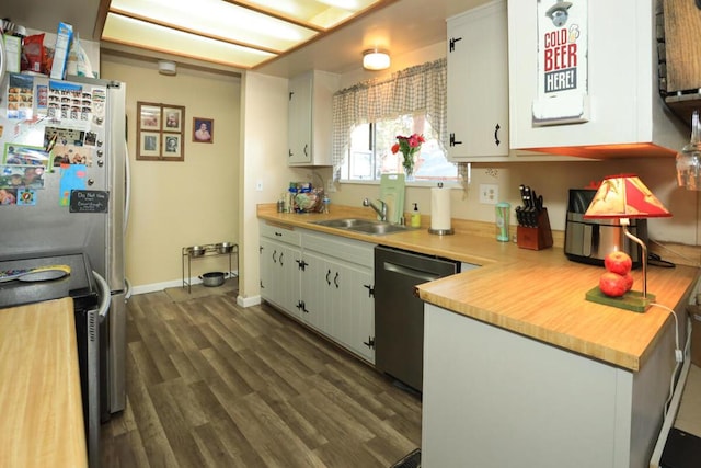 kitchen featuring sink, white cabinetry, black dishwasher, range with electric cooktop, and stainless steel refrigerator