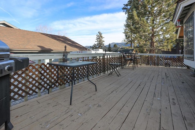 wooden terrace with a mountain view