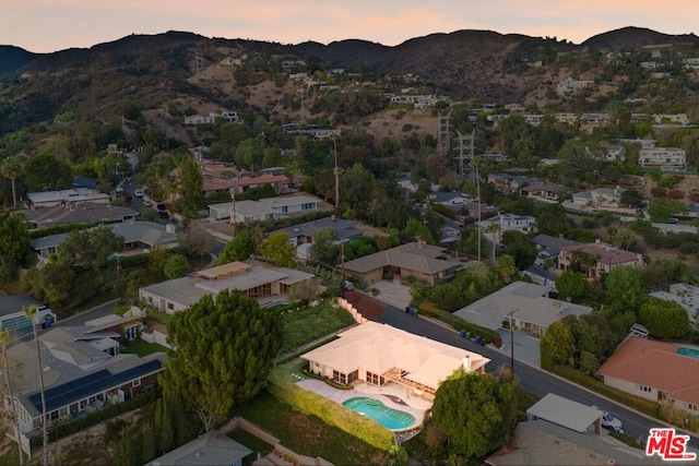 aerial view at dusk with a mountain view