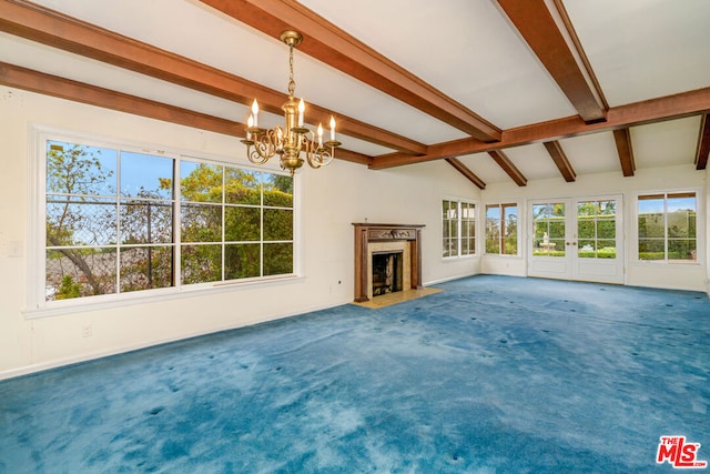 unfurnished living room with carpet, a high end fireplace, lofted ceiling with beams, and a notable chandelier