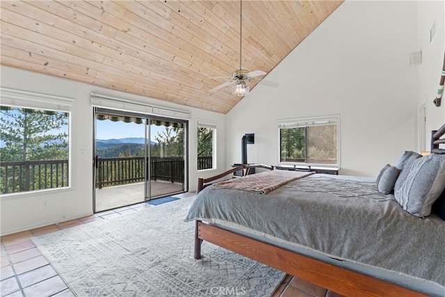 tiled bedroom with ceiling fan, access to outside, wooden ceiling, a mountain view, and high vaulted ceiling