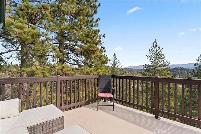 wooden deck with a mountain view