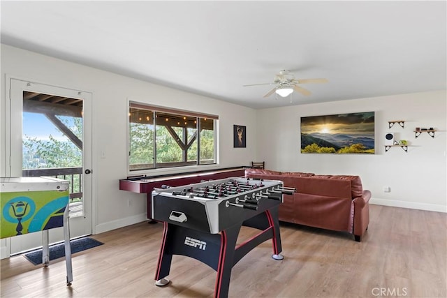 rec room featuring ceiling fan and light hardwood / wood-style floors