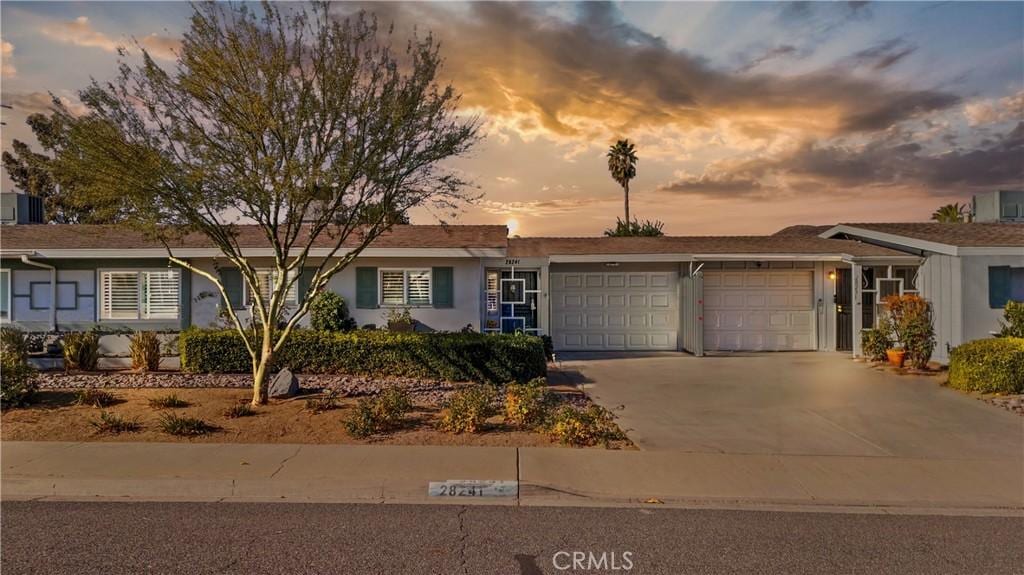 ranch-style home with a garage