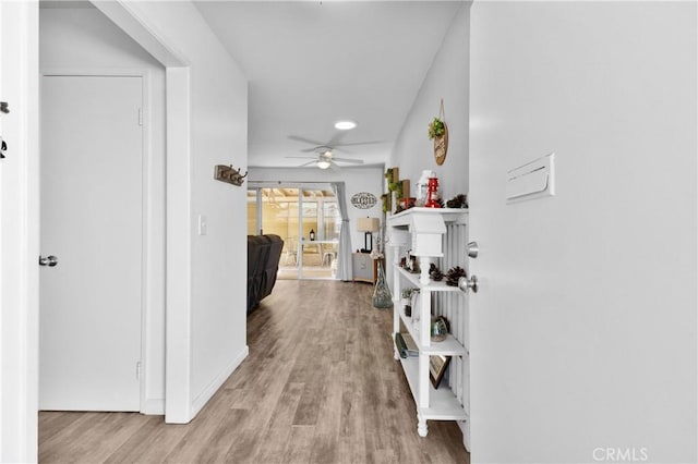 hall with light hardwood / wood-style floors