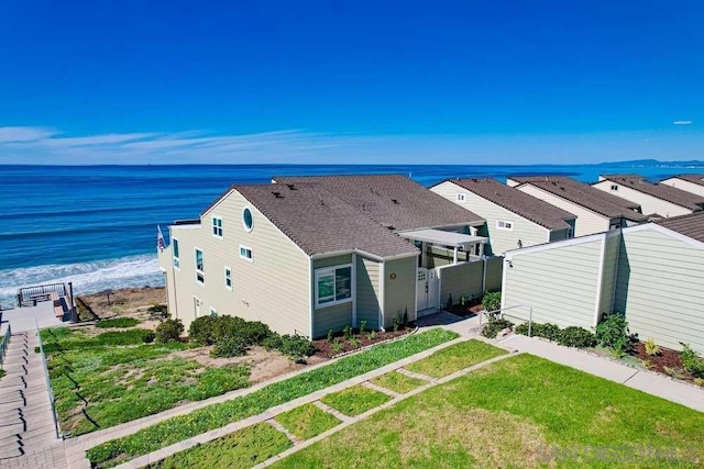 aerial view featuring a water view and a view of the beach