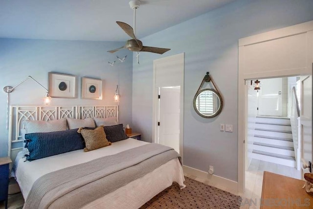 bedroom featuring vaulted ceiling and ceiling fan