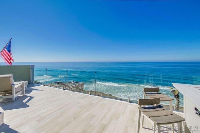 balcony featuring a water view