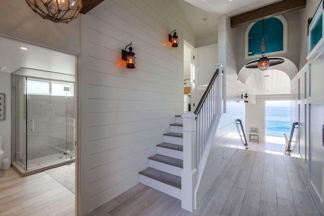 stairway featuring wood-type flooring