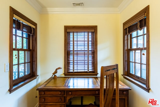 office area with ornamental molding