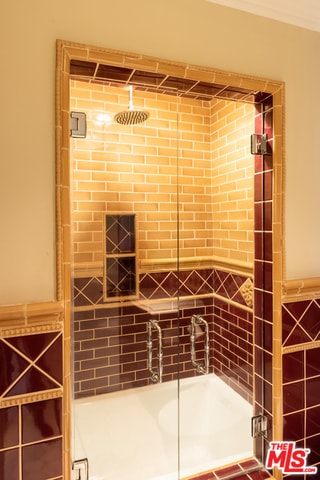 wine cellar with tile walls and crown molding