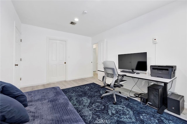 office area with wood-type flooring