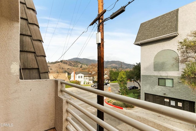 balcony featuring a mountain view