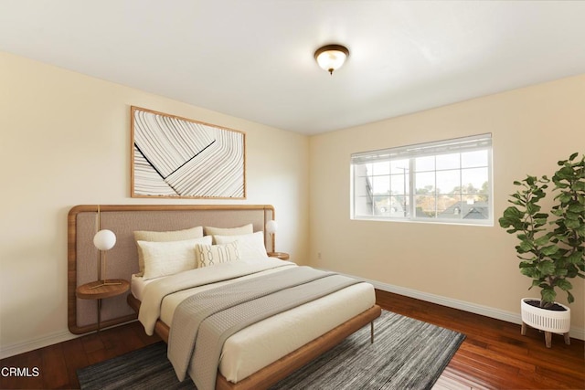 bedroom with dark wood-type flooring