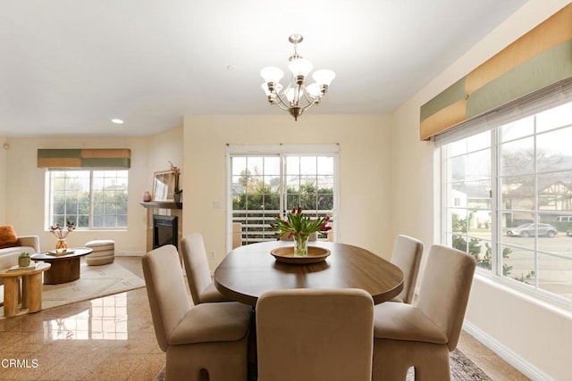 dining space with a notable chandelier