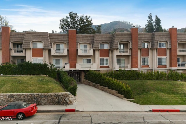 view of building exterior featuring a mountain view