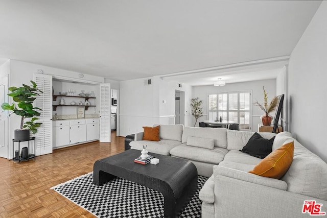 living room featuring light parquet floors