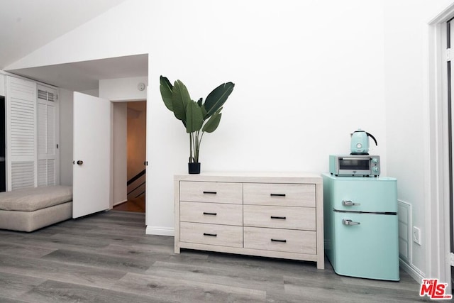 interior space featuring refrigerator and wood-type flooring