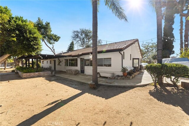 rear view of property with a patio