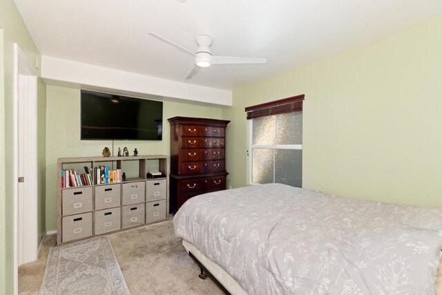 bedroom featuring ceiling fan and light colored carpet