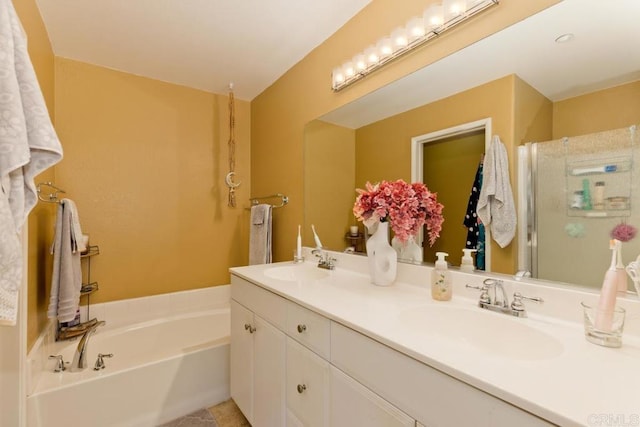 bathroom with a tub and vanity