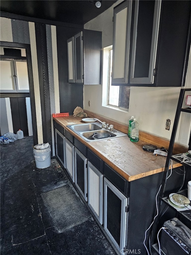 kitchen with sink and wood counters