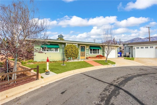 single story home featuring a garage and a front lawn