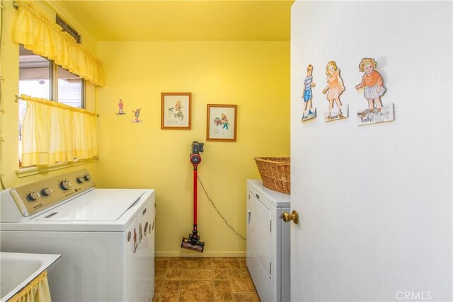 laundry room with sink and washer and clothes dryer