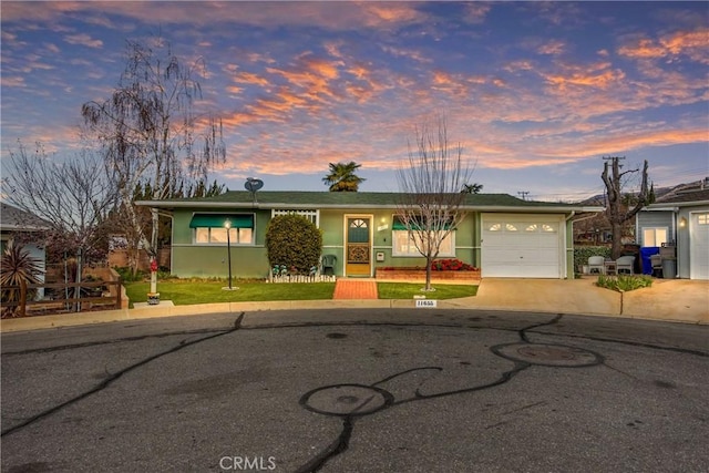 ranch-style home featuring a garage