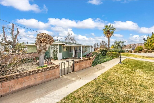 view of front of home with a front lawn