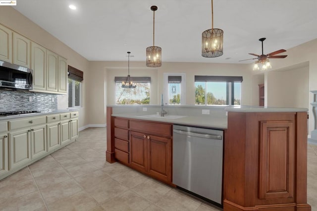 kitchen featuring sink, plenty of natural light, tasteful backsplash, and appliances with stainless steel finishes