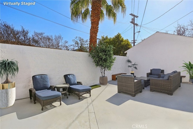 view of patio / terrace with outdoor lounge area and a fenced backyard